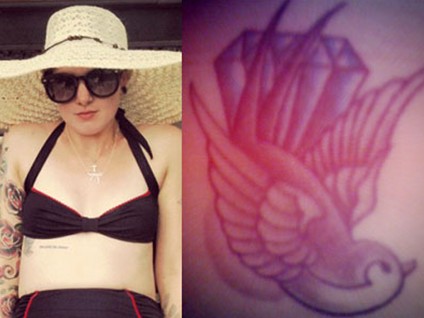 Beth Lucas’ tattoos – diamond, swallow and lyric on ribcage