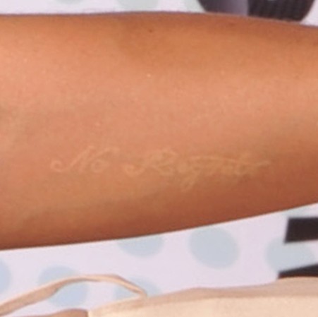 Cassie tattoos – white tattoo on forearm