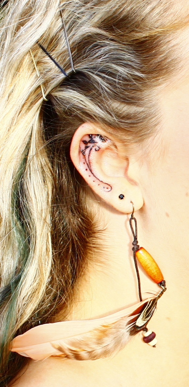 Pretty Inner Ear Tattoo