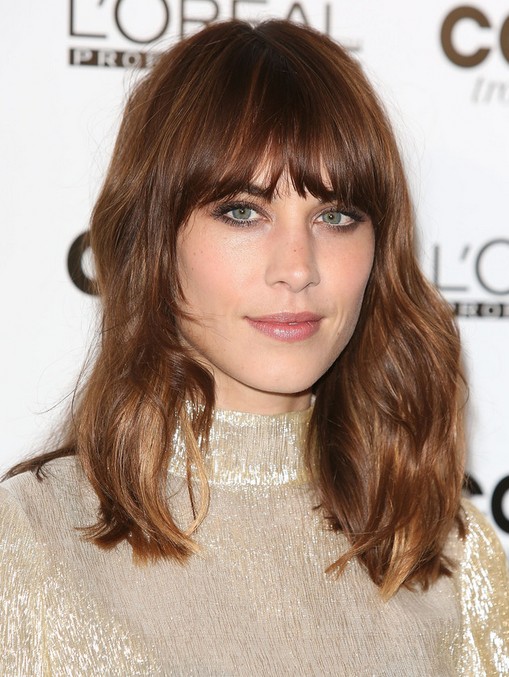 Alexa Chung Medium Wavy Hairstyle with Blunt Bangs