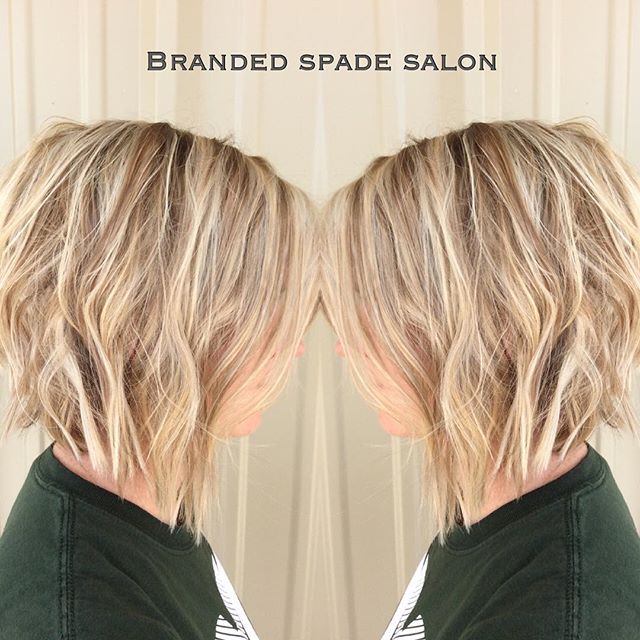Side view of short blonde angled bob hairstyle