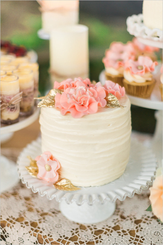 Wedding Cake with Pink Flowers and Gold Leaves