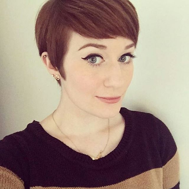 chic short pixie cut with side swept bangs
