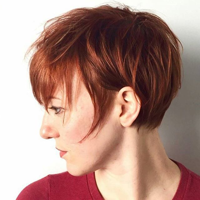 side view of redhead - short messy pixie cut with bangs