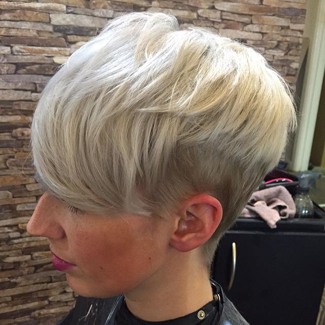 side view of short blonde pixie cut