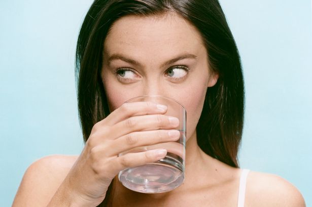 Woman Drinking Glass of Water