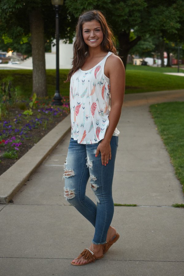 Ripped Jeans and White Feather Tank Top via