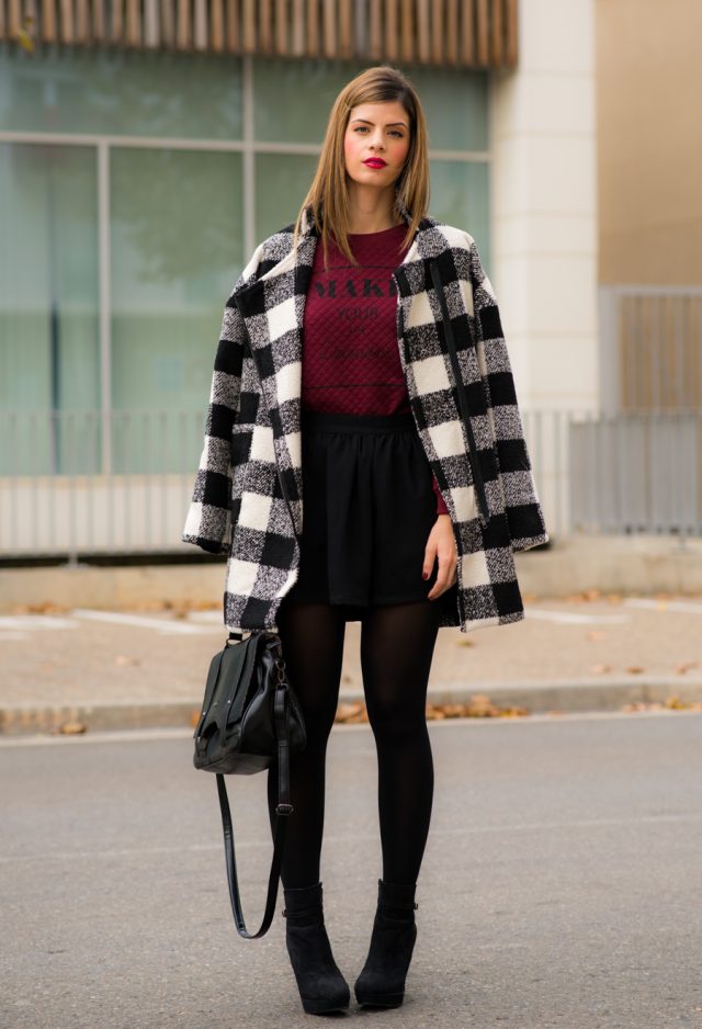 tartan-coat-red-top-black-skirt-and-boots via